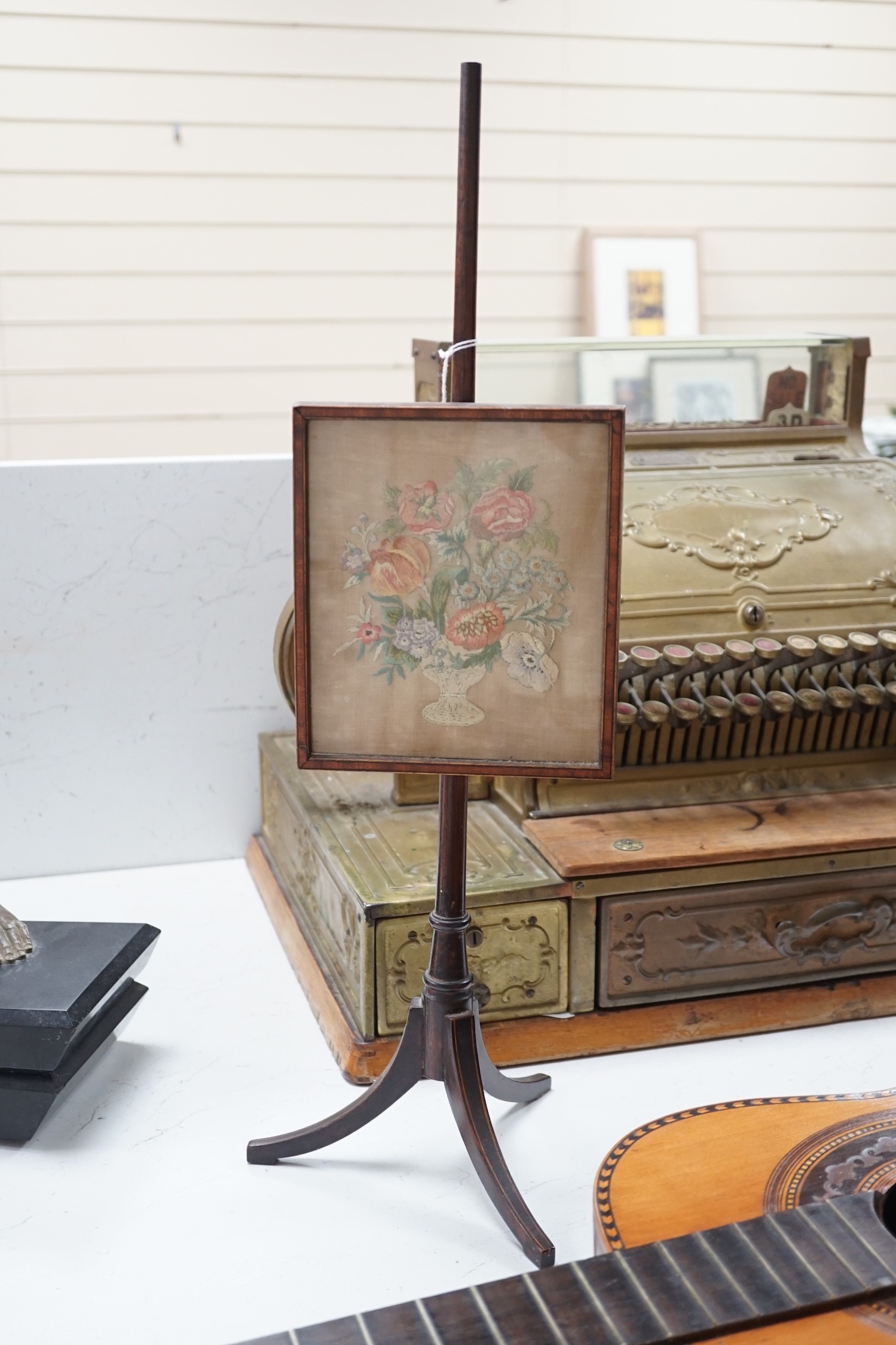 A 19th century mahogany table top embroidered face screen and stand, 59cm total height